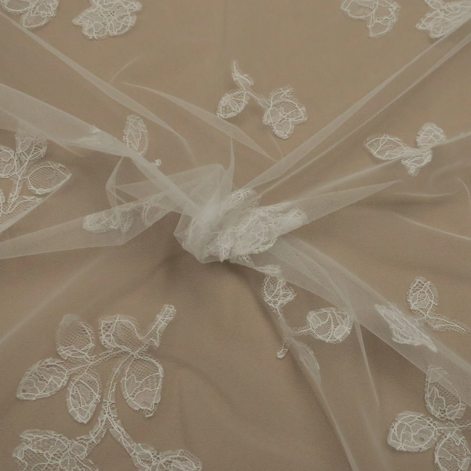 White Tulle with White Floral Design Embroidered Fabric