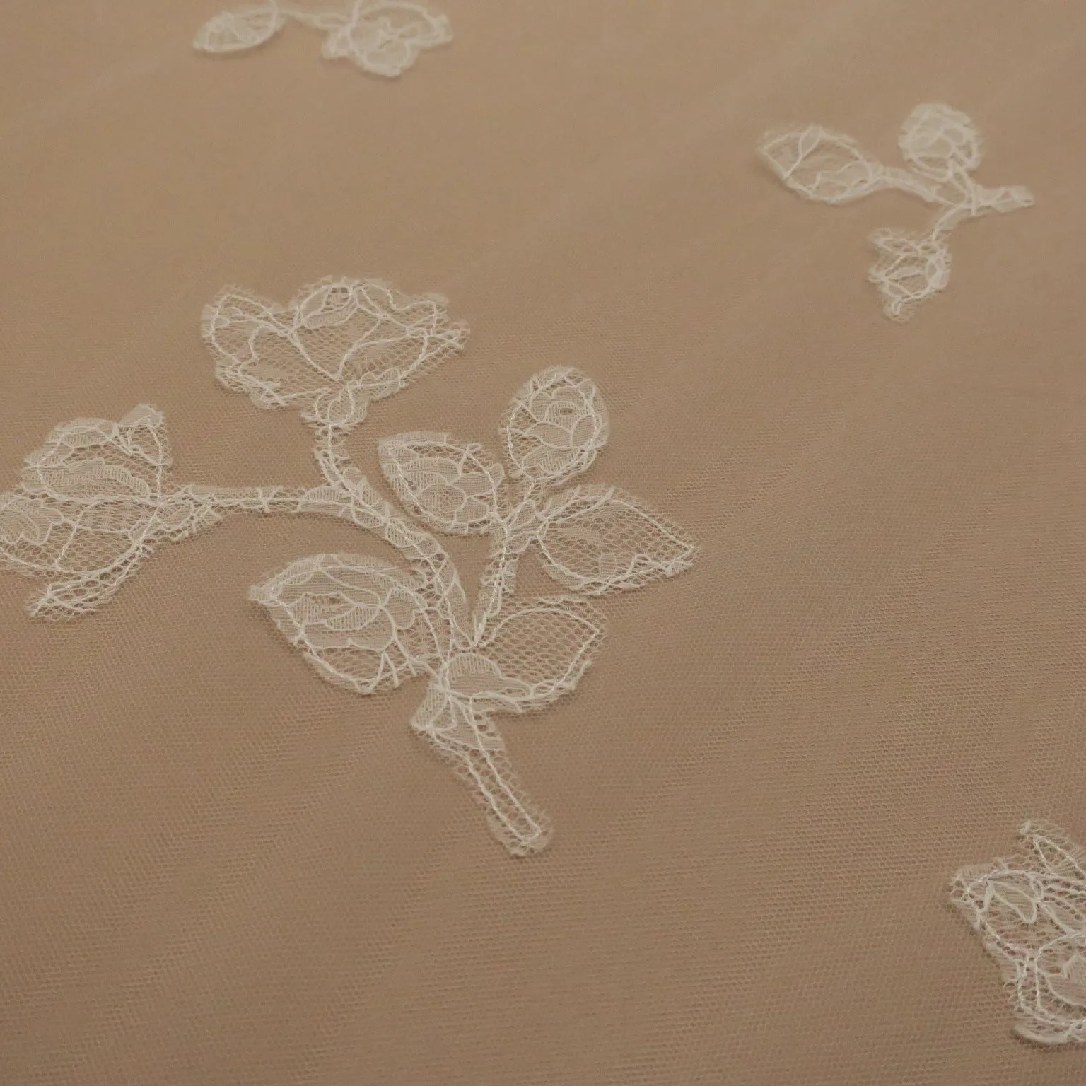 White Tulle with White Floral Design Embroidered Fabric